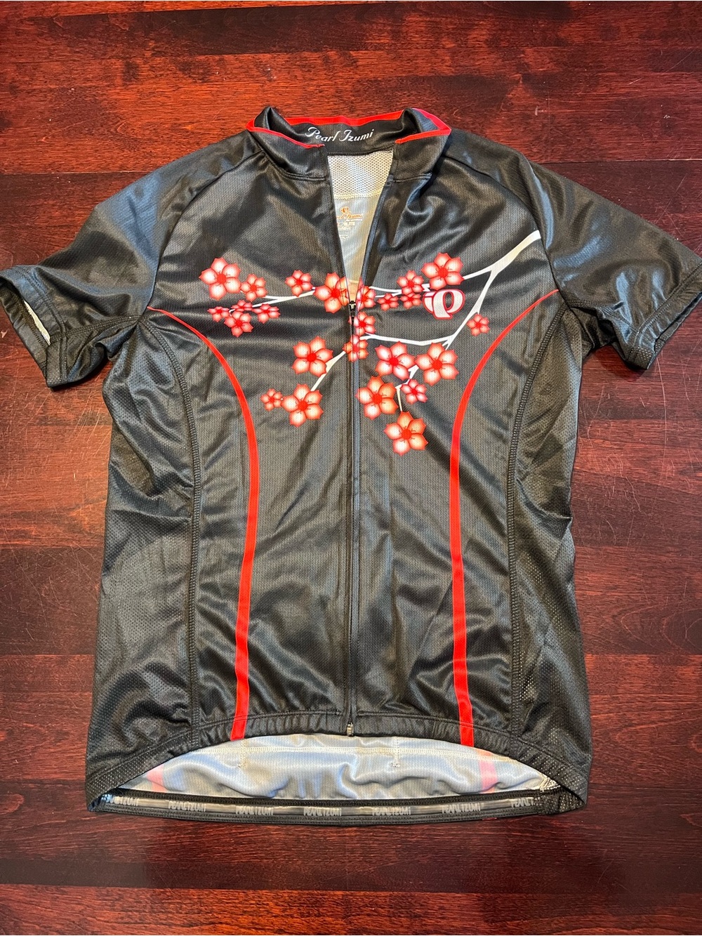 Pearl Izumi women’s  Black Cycling Jersey with Red Floral Design